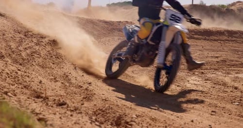 Dust, sand and bike in sports for adventure, fitness or adrenaline with desert in countryside