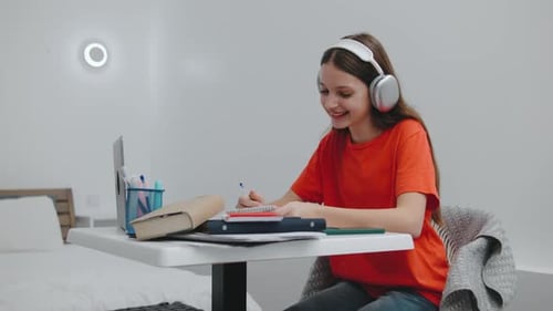 Teen Studying Online with Laptop and Headphones