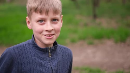 Closeup Portrait of Happy Little Child in City Park Kid Boy Outdoors Closeup Body Part Cute