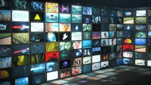 Massive curved wall of content-rich video tiles covering topics such as world news, cybersecurity