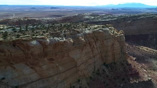 Beautiful aerial footage of canyons full of red rocks in utah