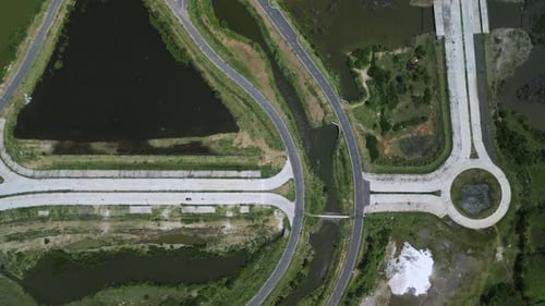 Aerial View of Roads Intersecting with River and Ponds