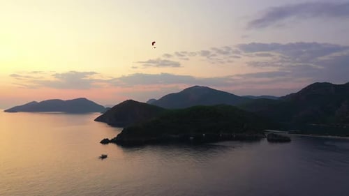 Scenic View of Majestic Sunset Over Sea and Mountains