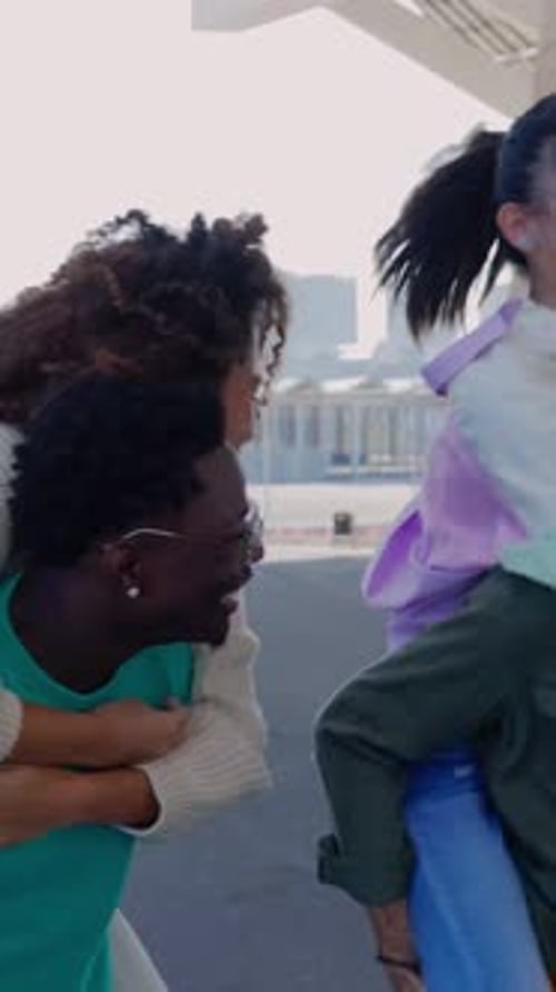 Mixedrace Young People Having Fun Together at City Street