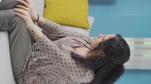 Vertical video of A young woman with a mood swing.