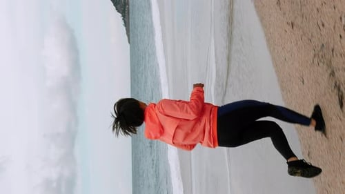 Woman Running on Beach for Fitness and Health