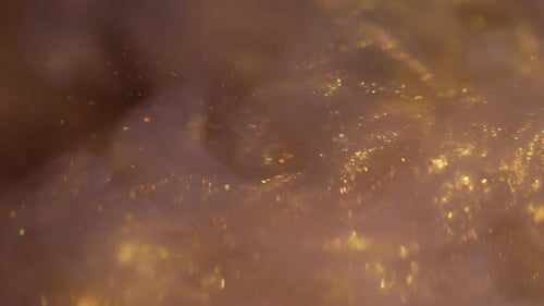 Golden Glittering Sparkles Swirling Abstractly