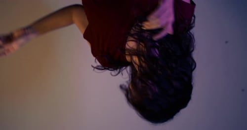 Woman with Curly Hair Dance in Neon Colors