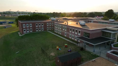 Aerial of American school building at summer sunset. Education theme in USA.