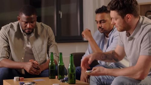 Leisure Games, Friendship and Gambling - Male Friends Playing Cards and Drinking
