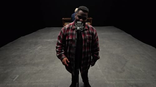 Man Sings In Front Of A Microphone