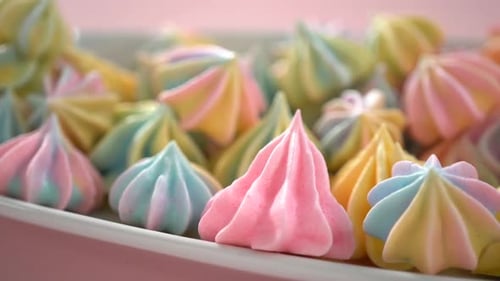 Multicolored Unicorn Meringue Cookies on a White Serving Plate