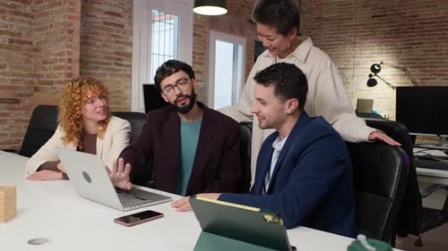 Collaborative Team Working Together on Project in Modern Office