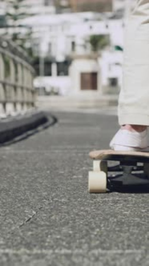 Feet, skateboard and travel with man on bridge in city for hobby, morning commute or sports