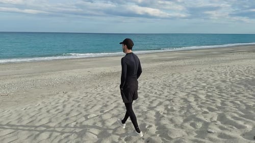 Athlete Taking A Rest Walking To The Sea