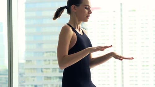 Young Woman Doing Warmup, Running by Window in Gym, Super