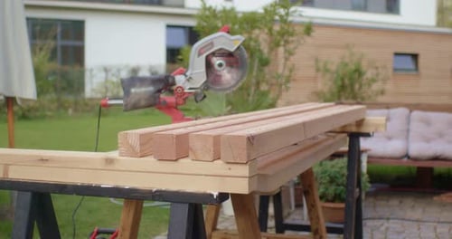 Lumber and Power Saw at Construction Site