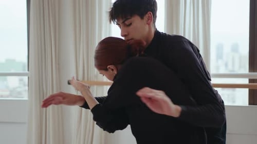 Couple Performing Modern Dance in a Rehearsal Studio