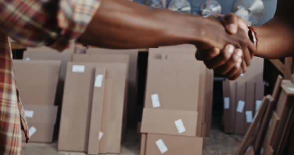 Businessman handshake with worker from moving service, Business ...