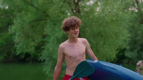 Alone Boy Floating on Stand Up Paddle Board in Lake in Summertime Standup Paddleboarding Surfer Rows