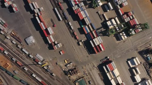 Many Multicolored Cargo Containers and Train Depot