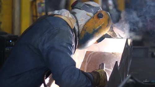 Worker Welding Metal with Protective Gear
