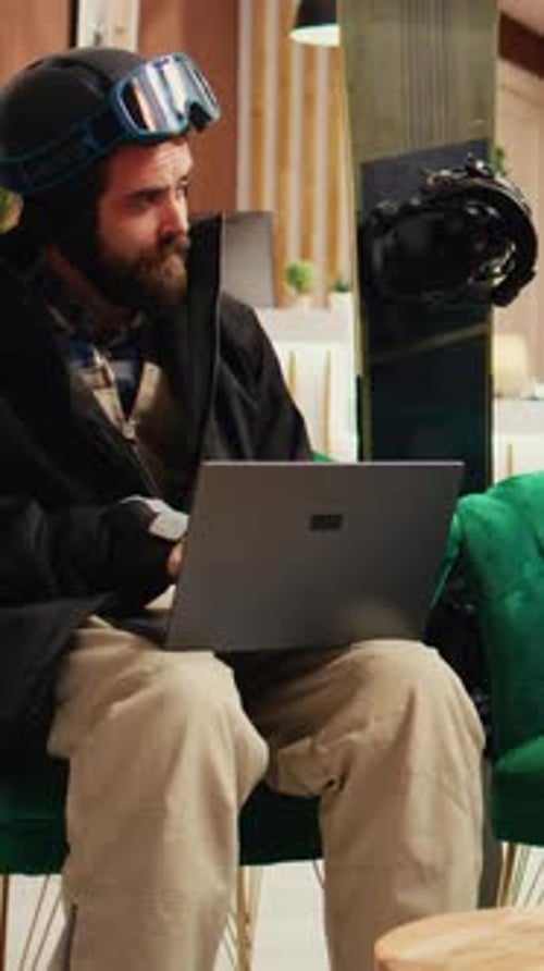 Vertical Video Focused Couple Using Gadgets in Lobby