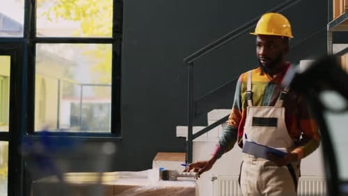 Female Manager Signing Papers in Depot