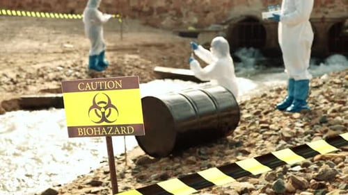 Workers Examine Biohazard Contamination in Stream