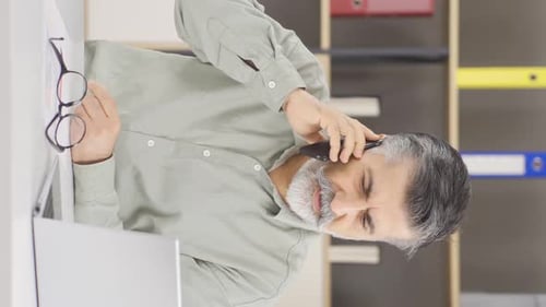 Vertical video of Busy work office manager, phone call.
