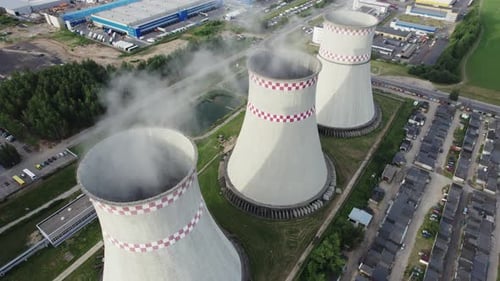 Aerial view of an industrial area in a big city. Chimneys of a thermal power plant.