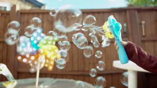 Playing with bubbles in the garden