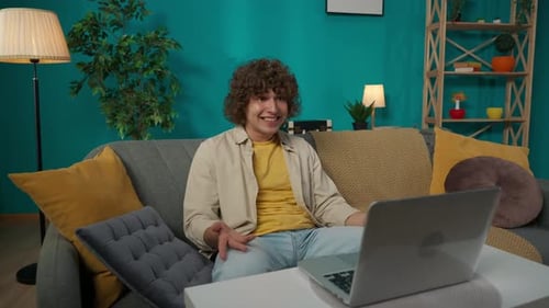 Man on Video Call at Home on Laptop