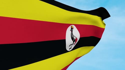 Uganda National Flag Waving in Realistic Fabric on Blue Sky