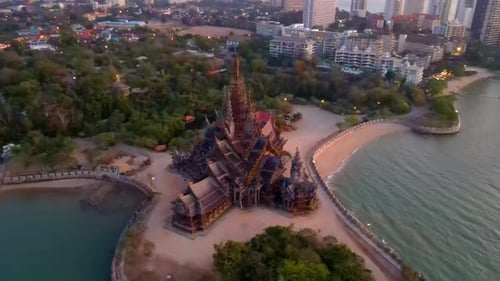 Temple on Coastline at Sunset in Urban Setting