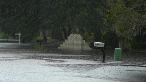 Hurricane Rainfall Flooded Florida Road in Suburban Residential Area Driving Hazardous Conditions
