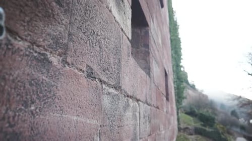 An impressive stone wall that is rough and textured with age and hardship