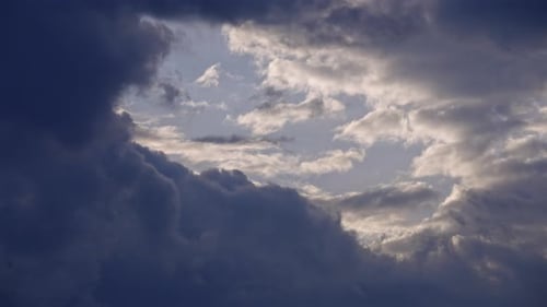 Dark Thunderstorm Clouds in Blue Sky