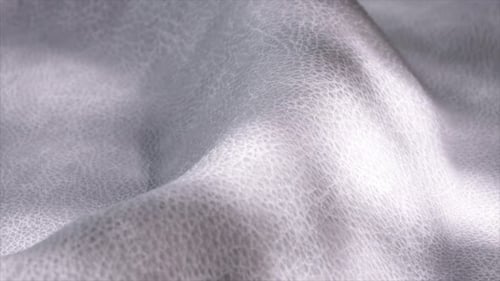 Soft Silver Leather Creates Gentle Waves Showcasing Its Luxurious Texture and Elegant Appearance