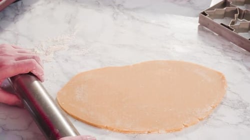 Rolling Dough for Christmas Cookies at Home