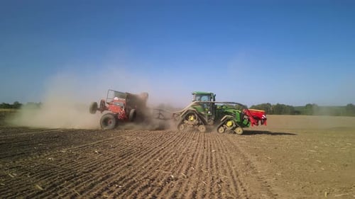 Tractor on the field seeding wheat