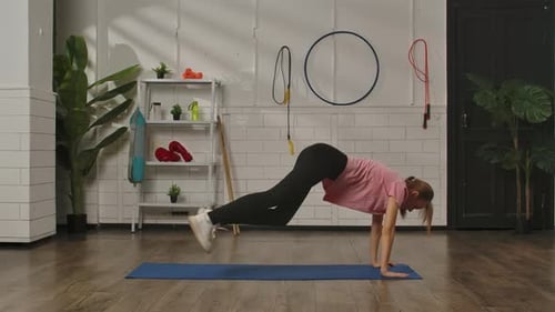 Woman Exercising in Bright Home Gym Environment