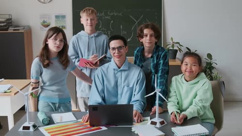 Teacher with Students in Classroom Discussing Wind Energy