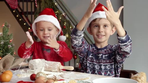Children Baking Christmas Cookies in Festive Home Setting