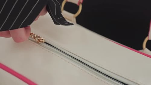 Hand Unzipping Bag to Drop Cheese on Kitchen Table