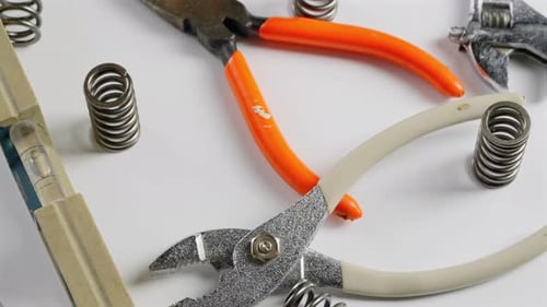 Household tools and random parts one might find in a kitchen or workshop drawer - turntable