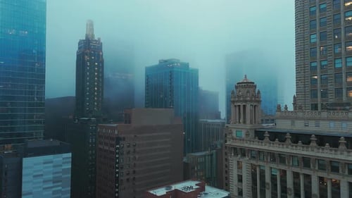 Wide Drone Footage of Downtown Chicago Under a Layer of Fog