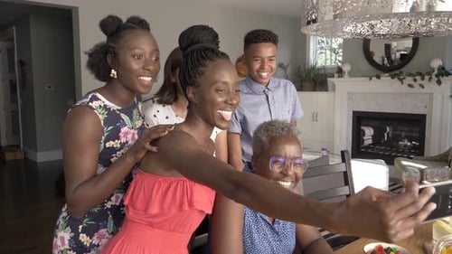 Family Gathered Together Taking Selfie Inside Modern Home