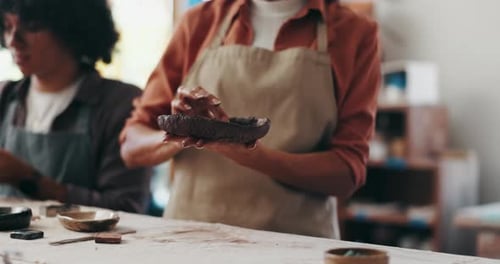 Pottery, art and hands of person in class, workshop or shape process for handmade ceramic design