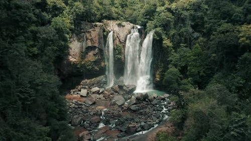Breathtaking Cinematic Aerial View of Majestic Tropical Waterfall Oasis Paradise
